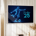 Framed soccer wall art displayed on a light wood-paneled wall in a home interior