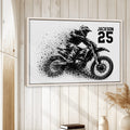 Motocross framed wall art displayed on a light wood-paneled wall in a relaxed home setting
