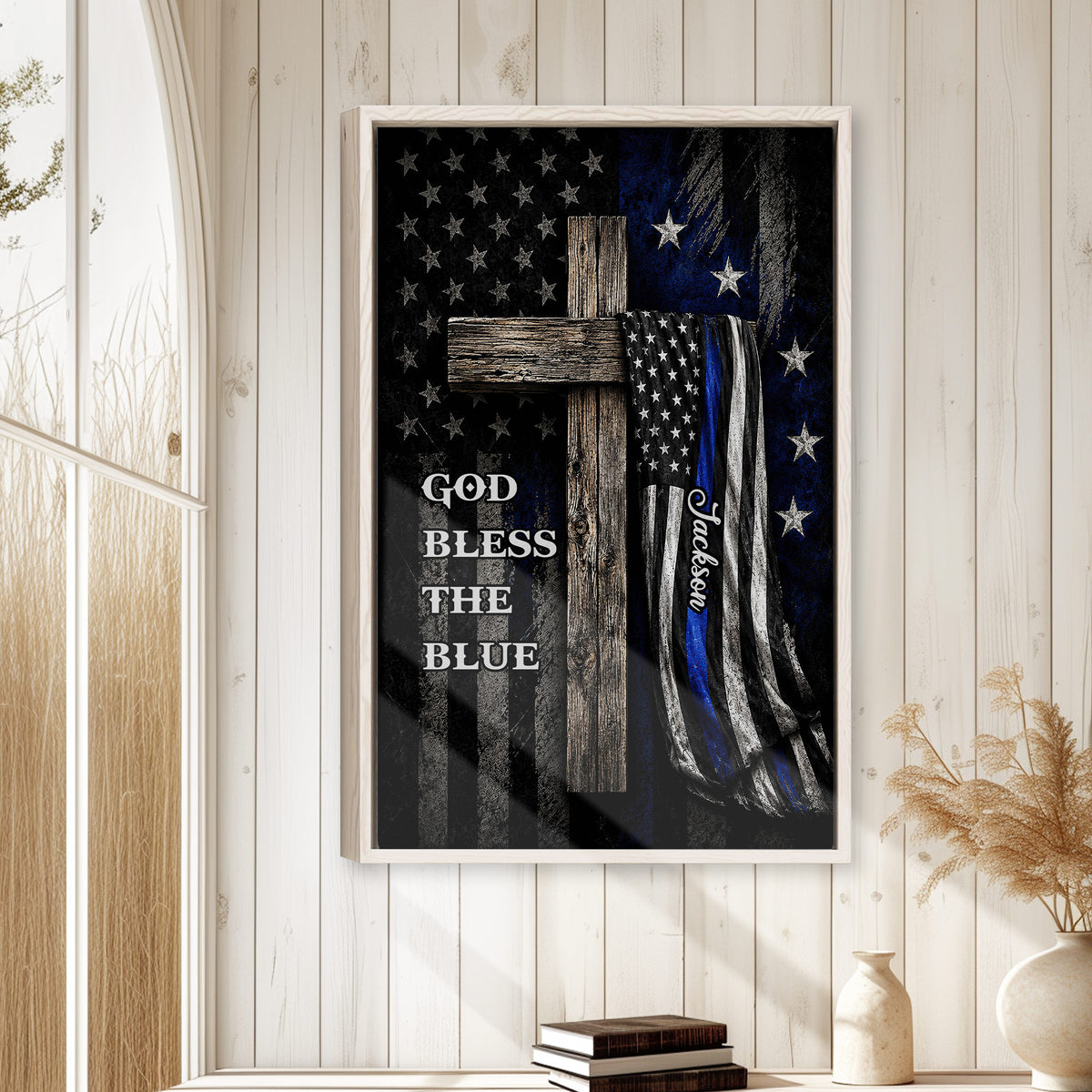 Police blue line wall art displayed in a bright rustic room with white wood paneling and natural decor