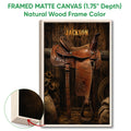 Framed matte canvas cowboy wall art shown with a natural wood frame and detailed saddle artwork