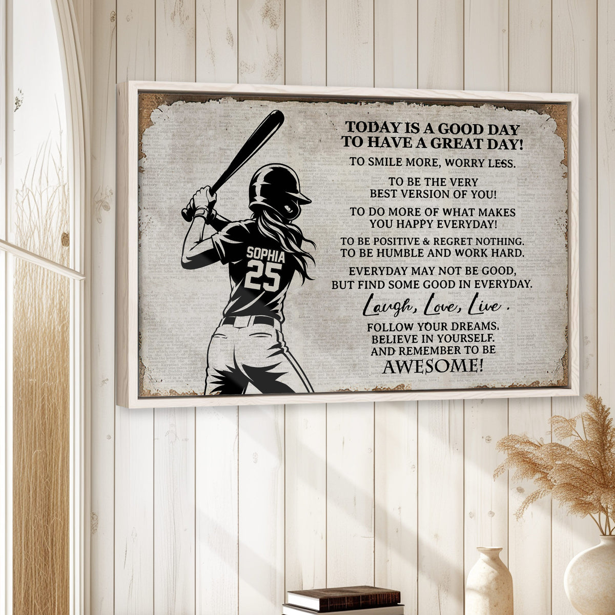 Framed softball wall art displayed on a light wood-paneled wall in a bright home interior