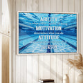 Swimming wall art displayed in a bright home interior above books and neutral decor