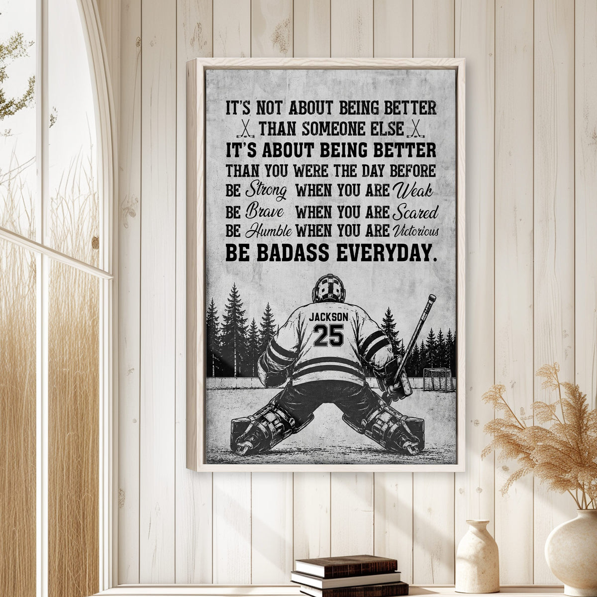 Framed hockey motivational wall art displayed on a light wood-paneled wall in a home interior