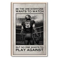 Framed football wall art showing a player holding a football in a stadium with bold black and white typography