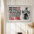 Motocross framed wall art displayed on a light wood-paneled wall in a warm rustic interior