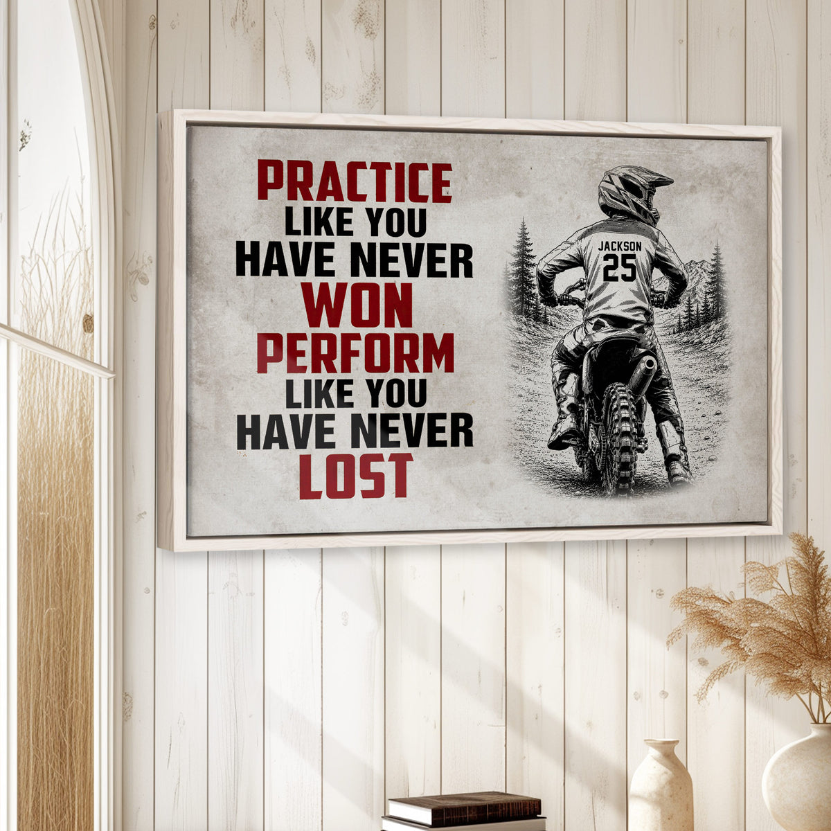 Motocross wall art displayed on a light wood-paneled wall in a bright home decor setting