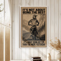Motocross wall art displayed on a light wood-paneled wall in a warm rustic home setting