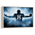 Framed football wall art featuring a player in a dark uniform against blue smoke and an inspirational scripture message