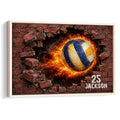 Framed volleyball wall art showing a blue and gold ball bursting through a brick wall with flames