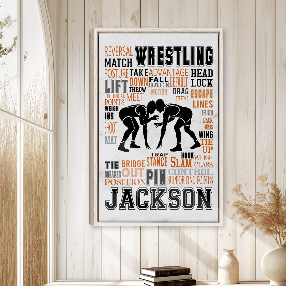 Framed wrestling wall art displayed on a light wood-paneled wall in a calm home interior