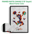 Black framed canvas wall art with a vibrant cheerleader, pom-poms and butterfly accents