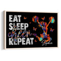 Framed cheerleading wall art featuring a colorful cheerleader, butterflies, and motivational lettering on black