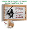 Natural wood framed baseball canvas showing a batter, stadium scene, and bold motivational typography