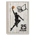 Framed basketball wall art showing a player reaching toward the hoop against a distressed white wood background