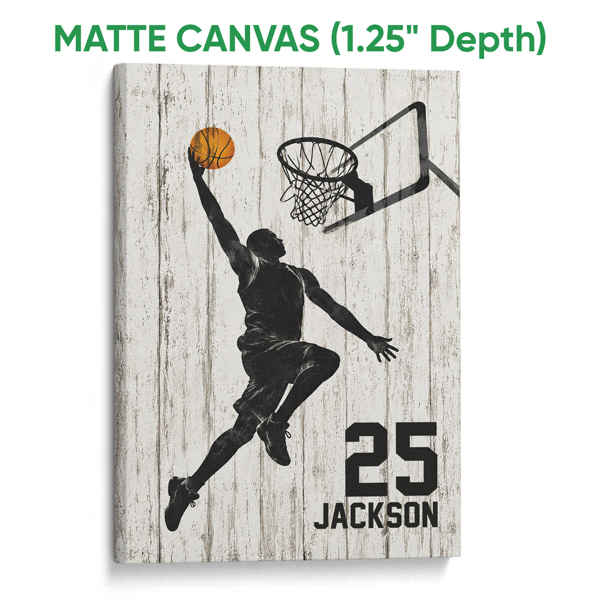 Matte canvas basketball wall art featuring a silhouetted player, orange ball and hoop on white wood