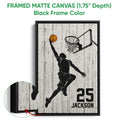 Black framed basketball canvas wall art with a player reaching for the ball and a close-up of the frame edge