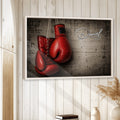 Framed boxing wall art displayed on a light wood-paneled wall in a home interior