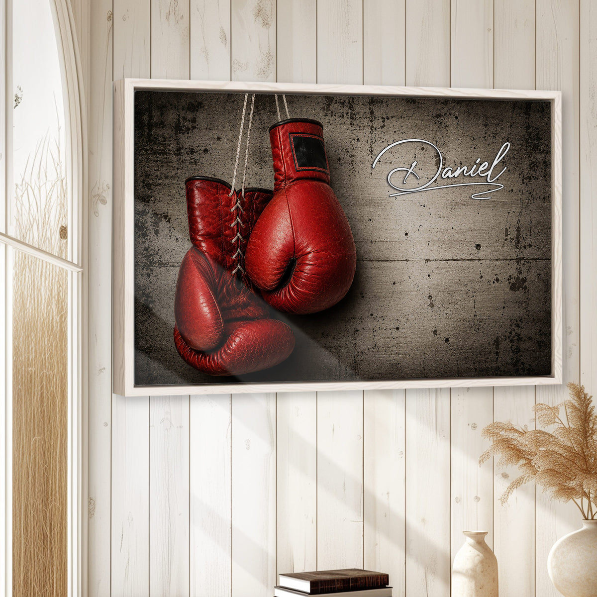 Framed boxing wall art displayed on a light wood-paneled wall in a home interior
