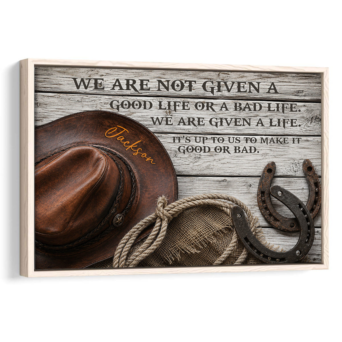 Framed cowboy wall art with a brown hat, rope, horseshoes and rustic Western typography