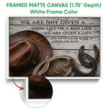 White framed cowboy canvas featuring Western imagery against weathered wood planks