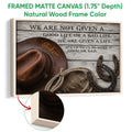 Natural wood framed cowboy canvas with a hat, rope, horseshoes and rustic Western styling