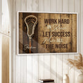 Lacrosse wall art displayed in a bright room with white wood walls and natural home decor