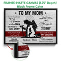 Black framed firefighter canvas wall art with a mother and child tribute design and close-up frame detail