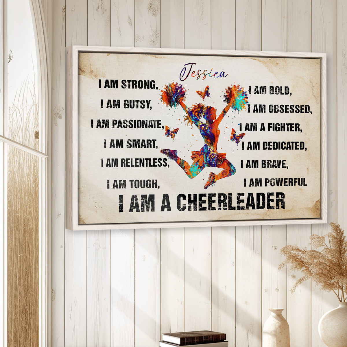 Cheerleading wall art displayed in a bright room with white wood walls and natural decor