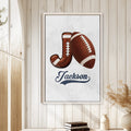 Football wall art displayed in a bright farmhouse-style room with light wood paneling