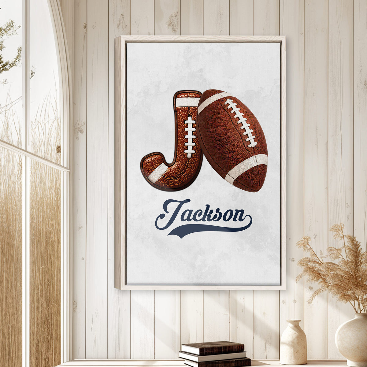 Football wall art displayed in a bright farmhouse-style room with light wood paneling