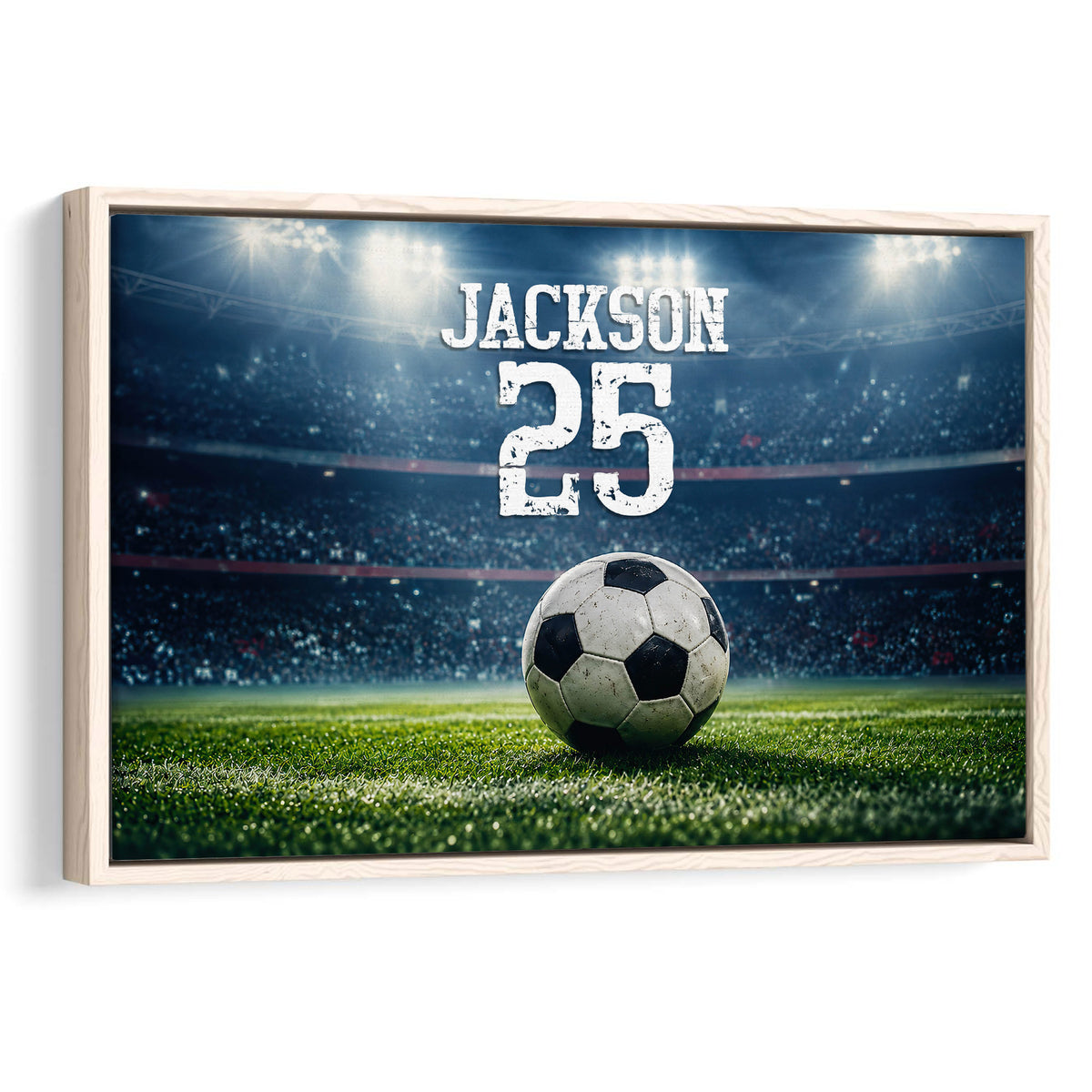Framed soccer wall art featuring a ball on a brightly lit stadium field