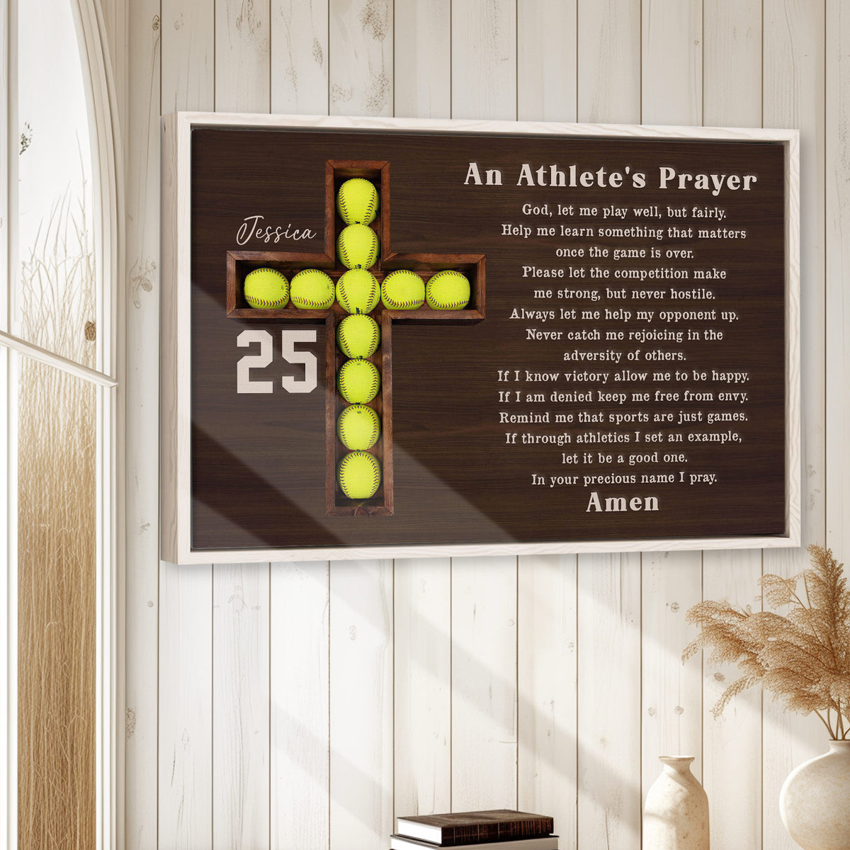 Framed softball prayer wall art displayed on a light wood wall in a warm home setting