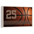 Custom basketball wall art with close-up orange basketball texture, bold player number and custom name on a dark sports background