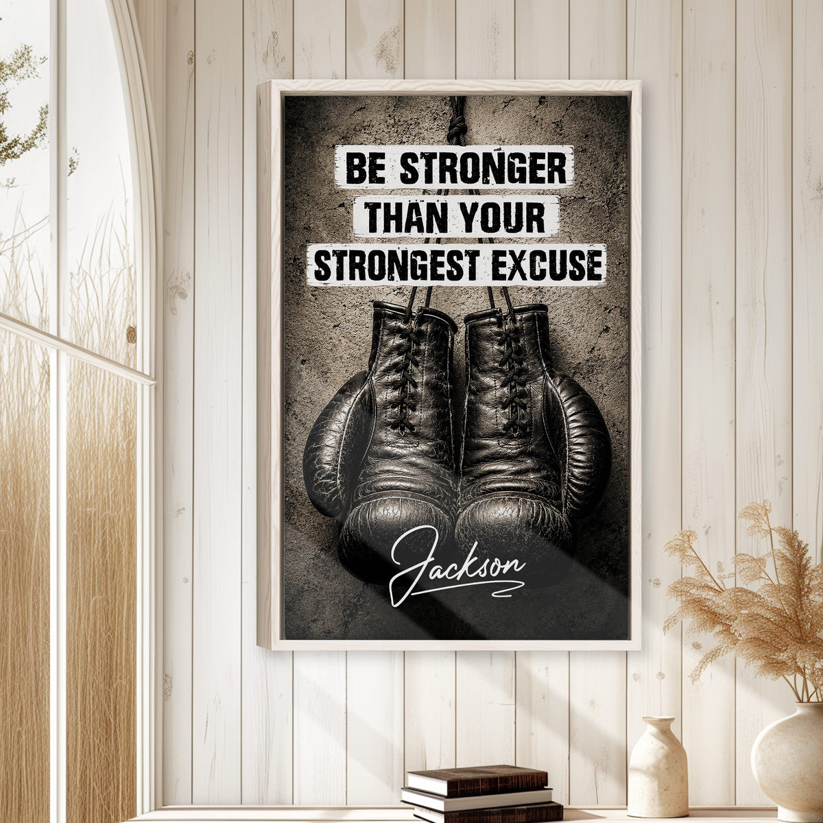 Boxing motivational wall art displayed in a bright room with white paneled walls and neutral decor