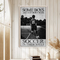 Soccer wall art displayed on a light wood-paneled wall in a bright home interior