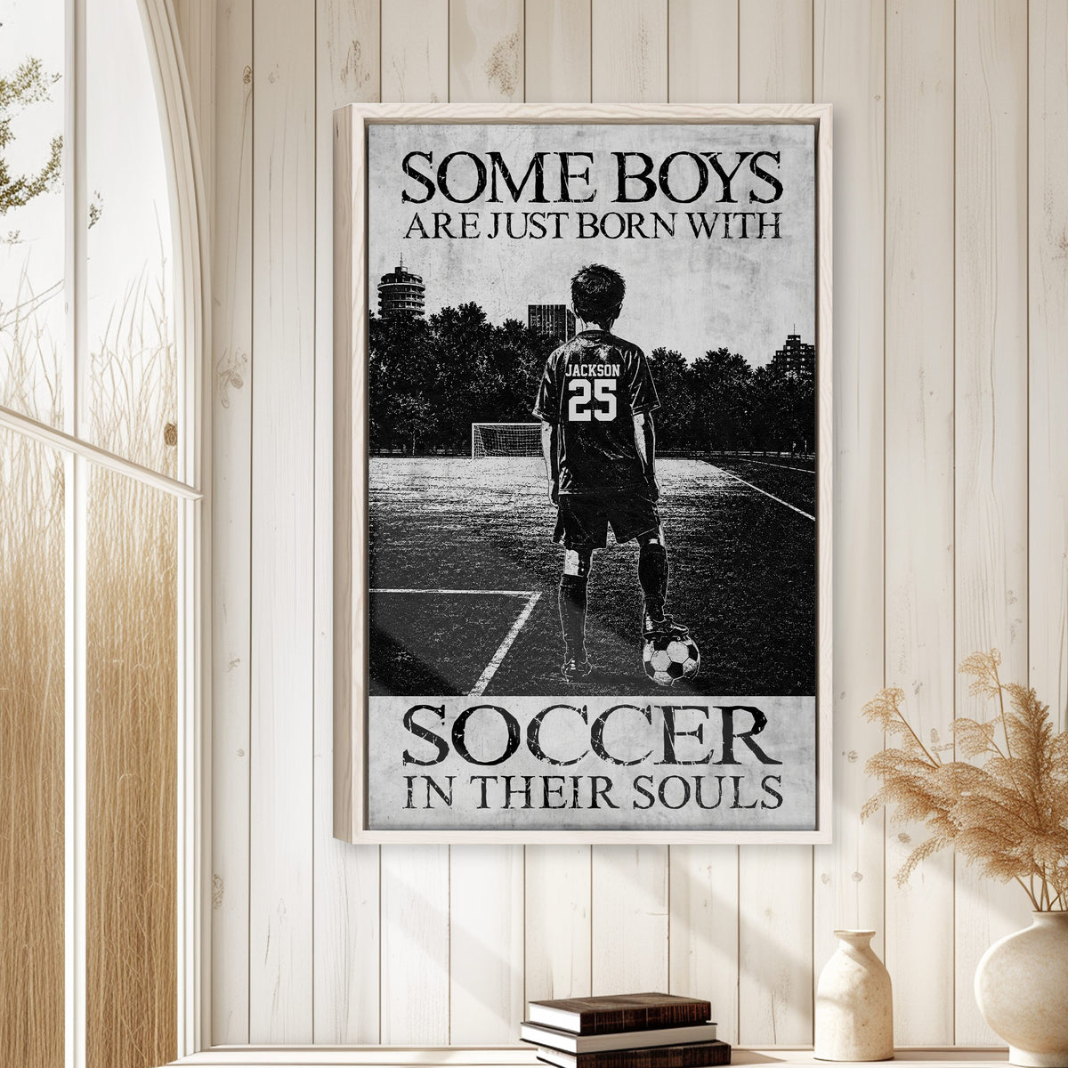 Soccer wall art displayed on a light wood-paneled wall in a bright home interior