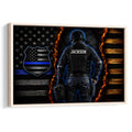 Framed police wall art featuring a tactical law enforcement officer, blue-line flag emblem, flames and dark wood texture