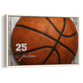 Framed basketball wall art featuring a close-up orange basketball against a rustic wood backdrop