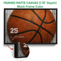 Black framed canvas basketball wall art with a detailed orange basketball design