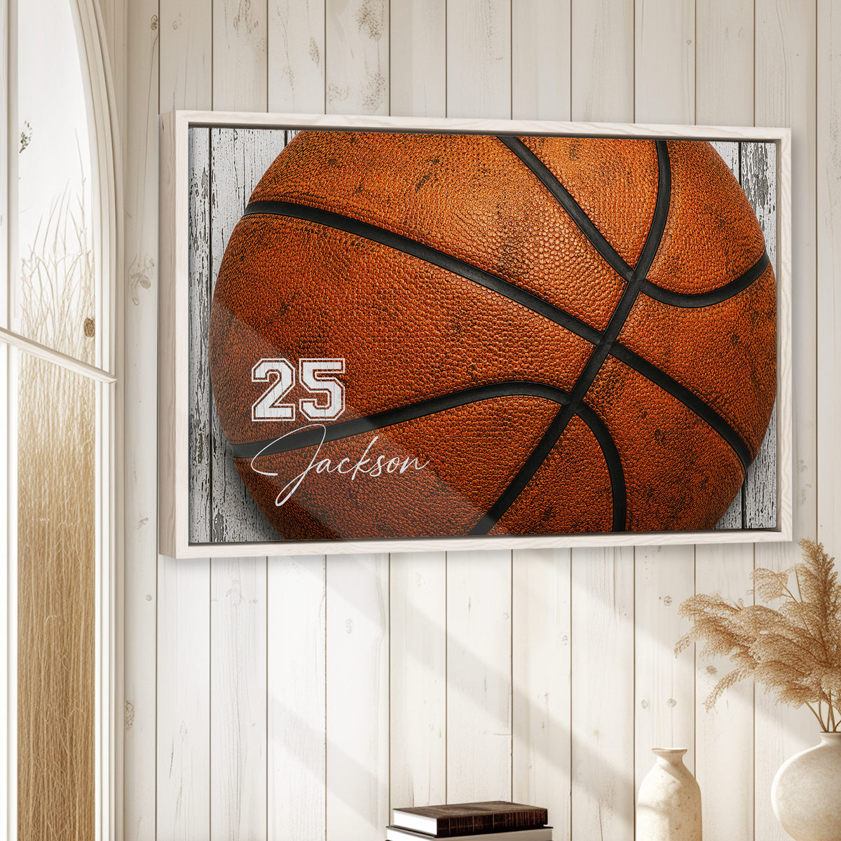 Basketball wall art displayed in a bright room with white wood walls and natural decor
