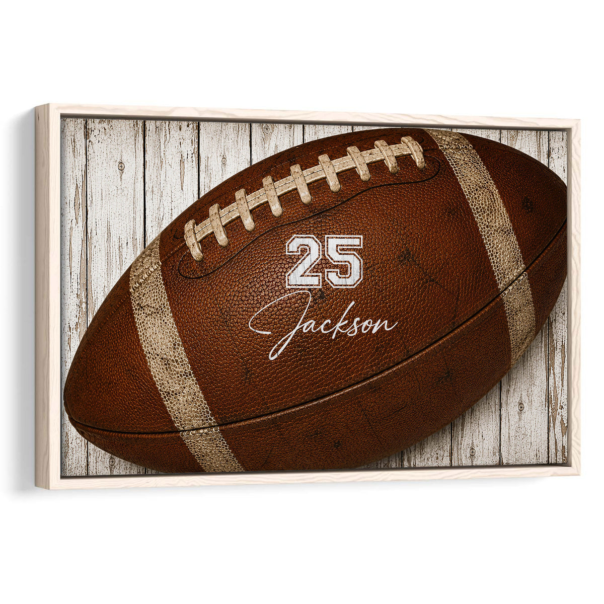Framed football wall art featuring a detailed brown football against rustic white wood