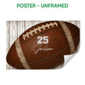Unframed football poster featuring a detailed brown football on a rustic white wood background