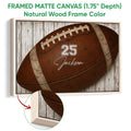 Natural wood framed football canvas wall art with a detailed brown football design