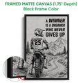 Black framed canvas motocross wall art with a dirt bike rider, evergreen trees, and mountain scenery