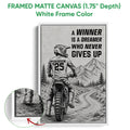 White framed canvas motocross wall art displaying a dirt bike rider on a rugged mountain trail
