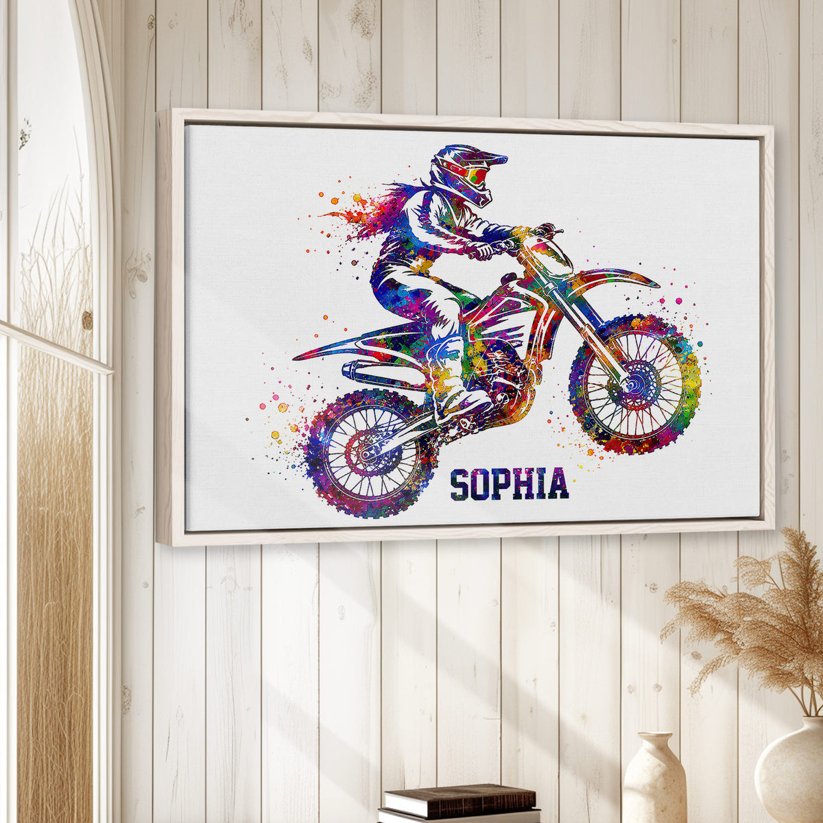 Framed motocross wall art displayed on a light wood-paneled interior wall