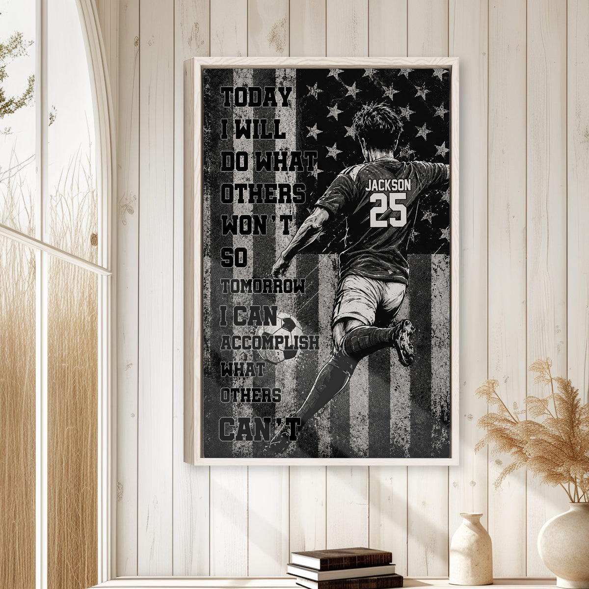 Soccer wall art displayed in a bright wood-paneled room above a small stack of books