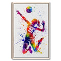 Colorful volleyball player wall art with a volleyball and dynamic paint splashes in a natural wood frame