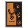 Framed hunting wall art featuring deer and antler emblems in a rustic black and amber design