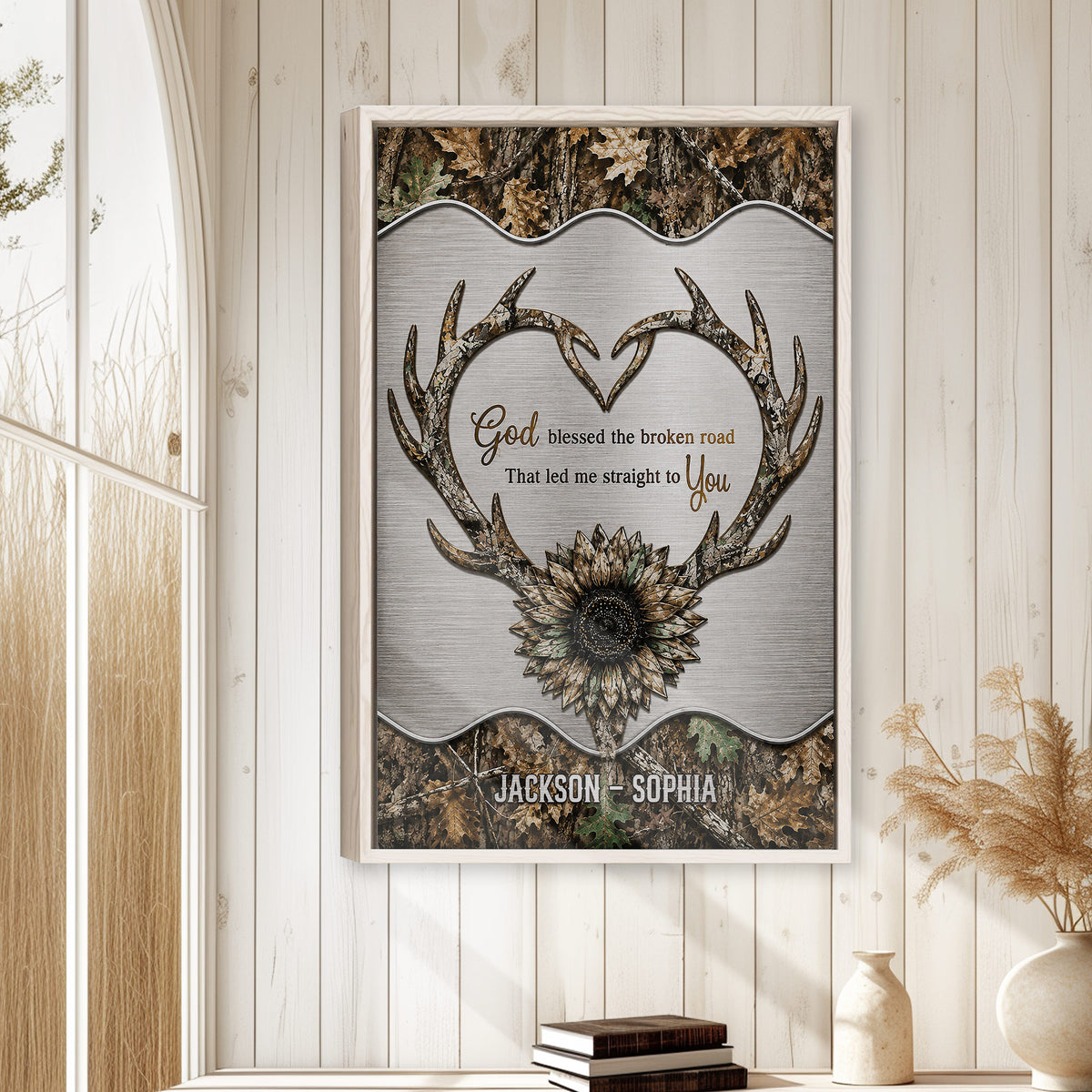 Hunting wall art displayed on a light farmhouse wall with antlers, camouflage and sunflower artwork